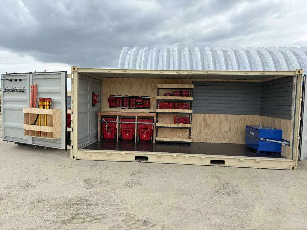 20-foot full open side container with one entire side open, set up with tool storage and shelving inside
